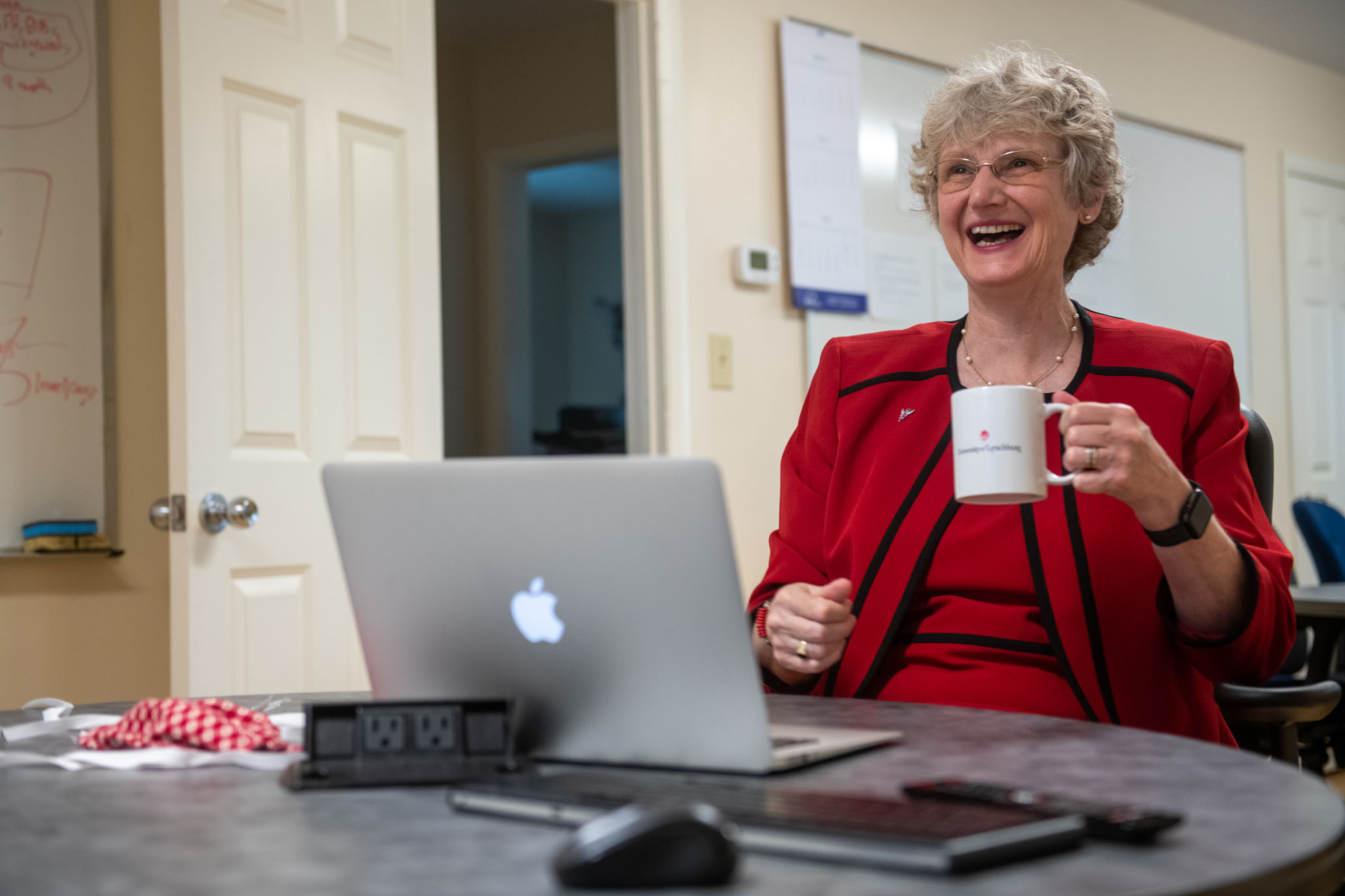 A picture of Alison Morrison-Shetlar smiling and holding a cup