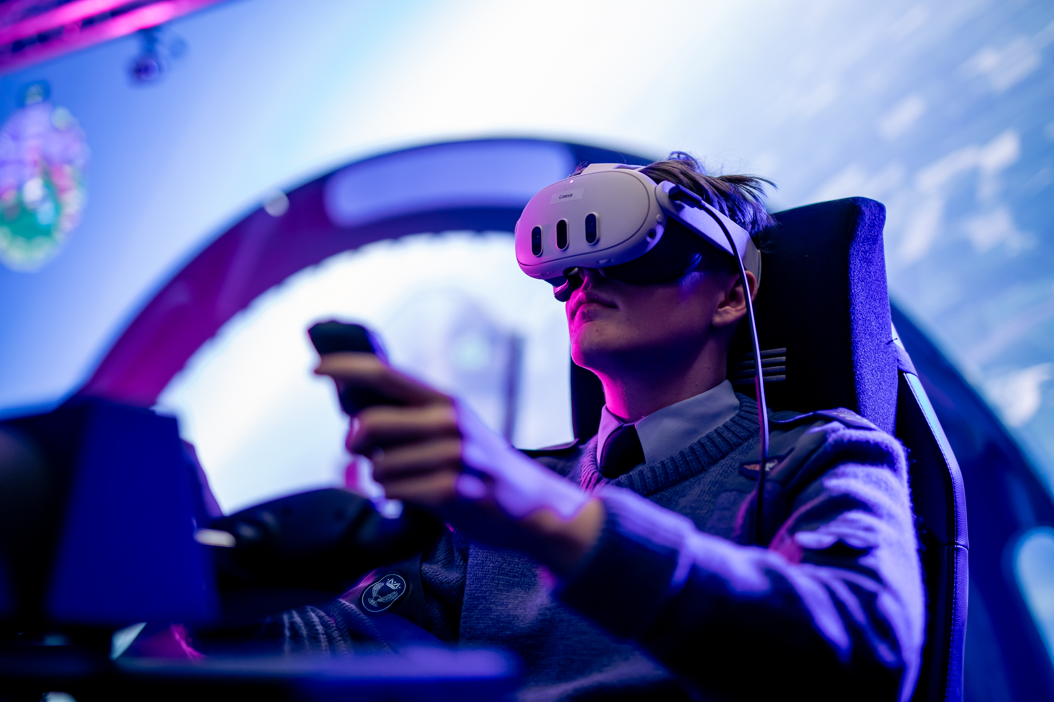 An Air Cadet from the 1232 (City of Dundee) Squadron Air Training Corps (ATC) uses the Virtual Reality headset linked up to the flight simulator at Abertay University, positioned in front of the ViPRE studio's huge LED screen